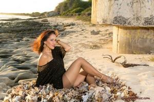 A photo shoot with gorgeous aged lady Rony is posing on the sea beach